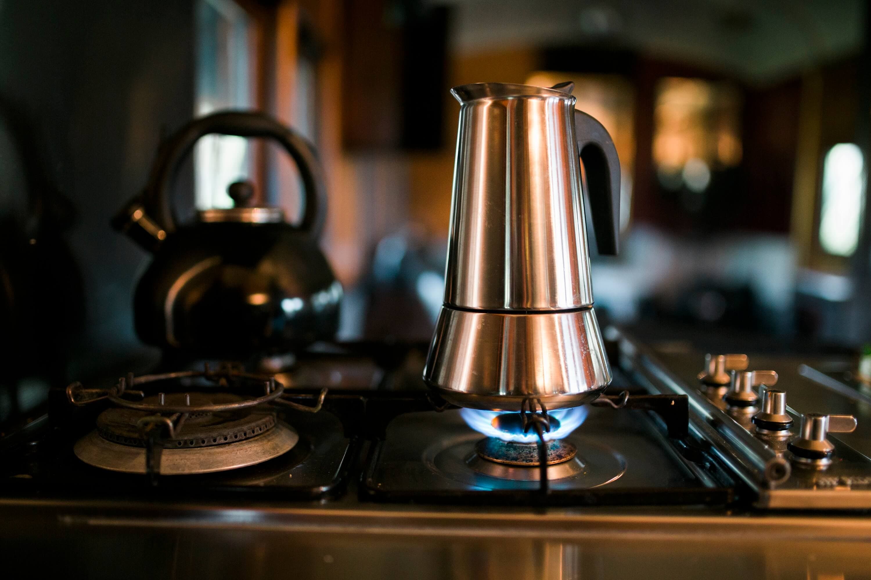Stovetop espresso sitting on top of a gas hob 