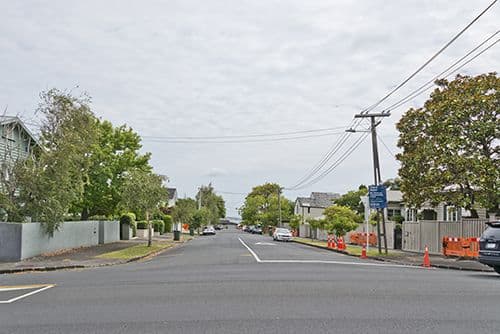 street with poles and overhead lines